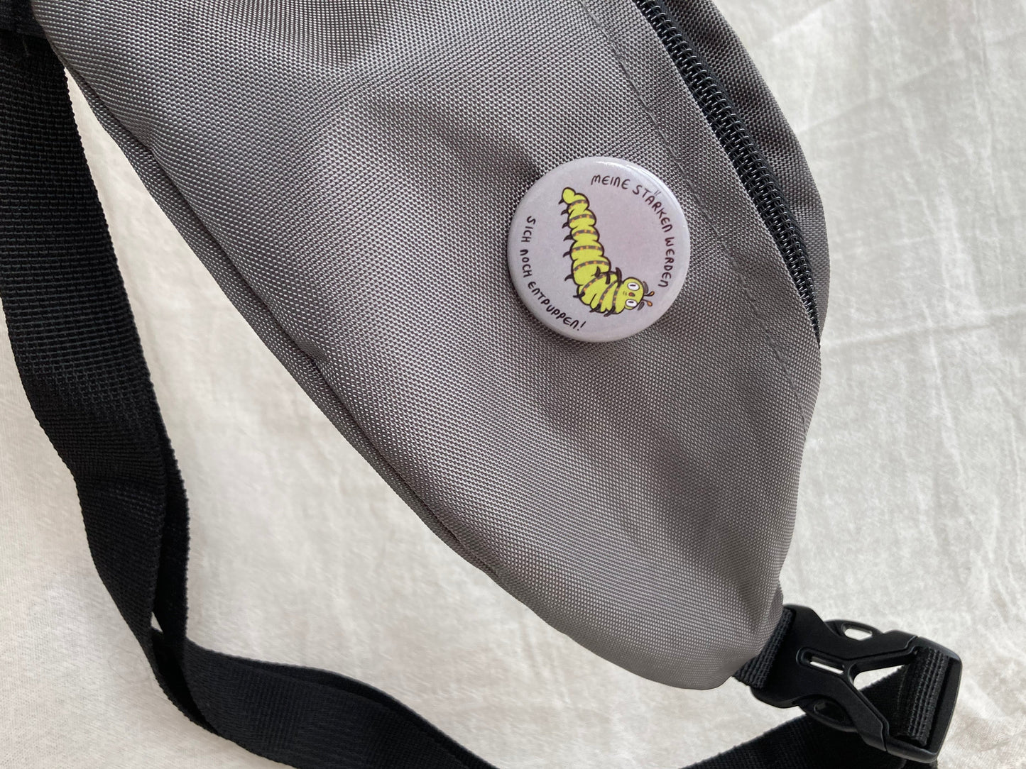 Raupen Button