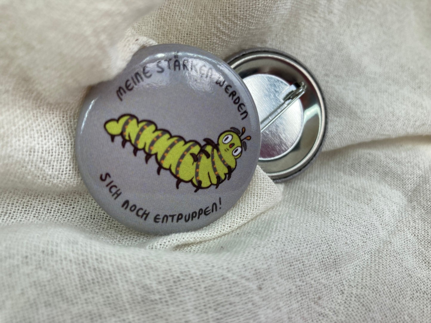 Raupen Button