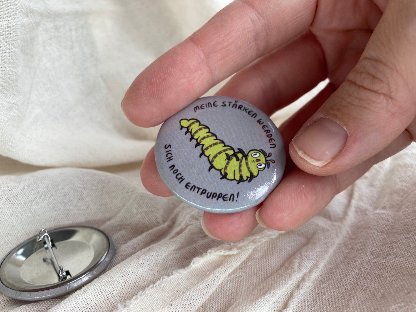 Raupen Button